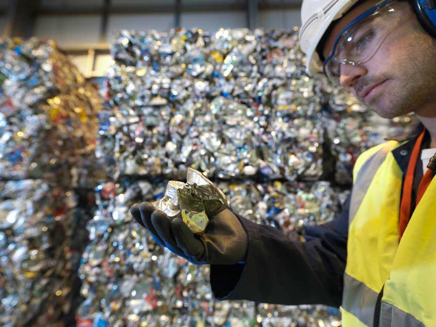 Work checking the quaulity and cleanliness of an aluminium can.